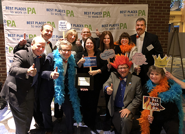 executives getting all fired up celebrating the best places to work award