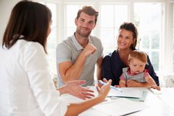 financial advisor meeting with younger couple