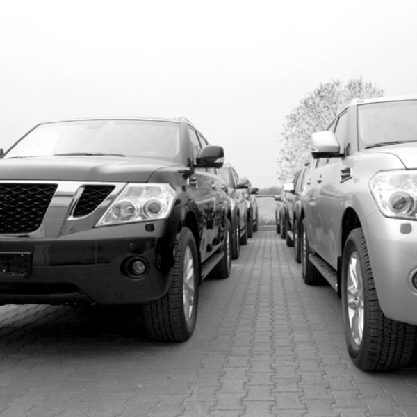 black and white image of rows of cars symbolizing auto loans.