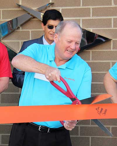pat austin cutting the ribbon to open Muhlenberg