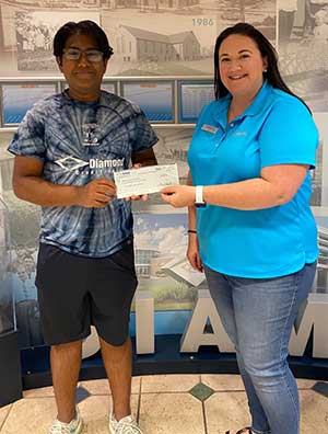 Kishan Patel receiving his scholarship at the Pottstown branch.