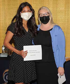 Aleena Ghanta receiving her scholarship at the Royersford branch.
