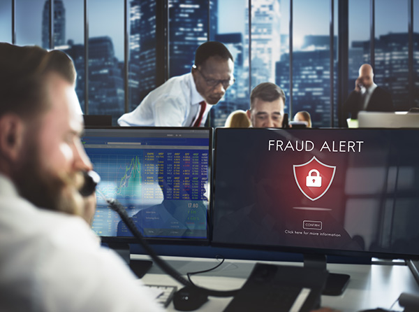 A man on the phone dealing with payment fraud.