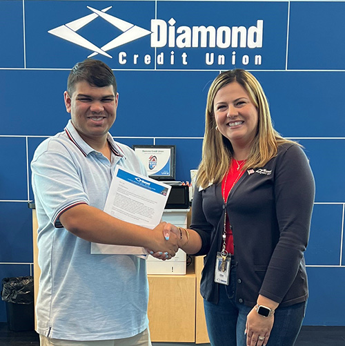 Diamond presents student with the panfile scholarship.