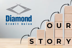 history timeline. stacks of increasing wooden blocks with black arrows following. "Our Story" written on the blocks and the diamond logo in the upper left hand side.